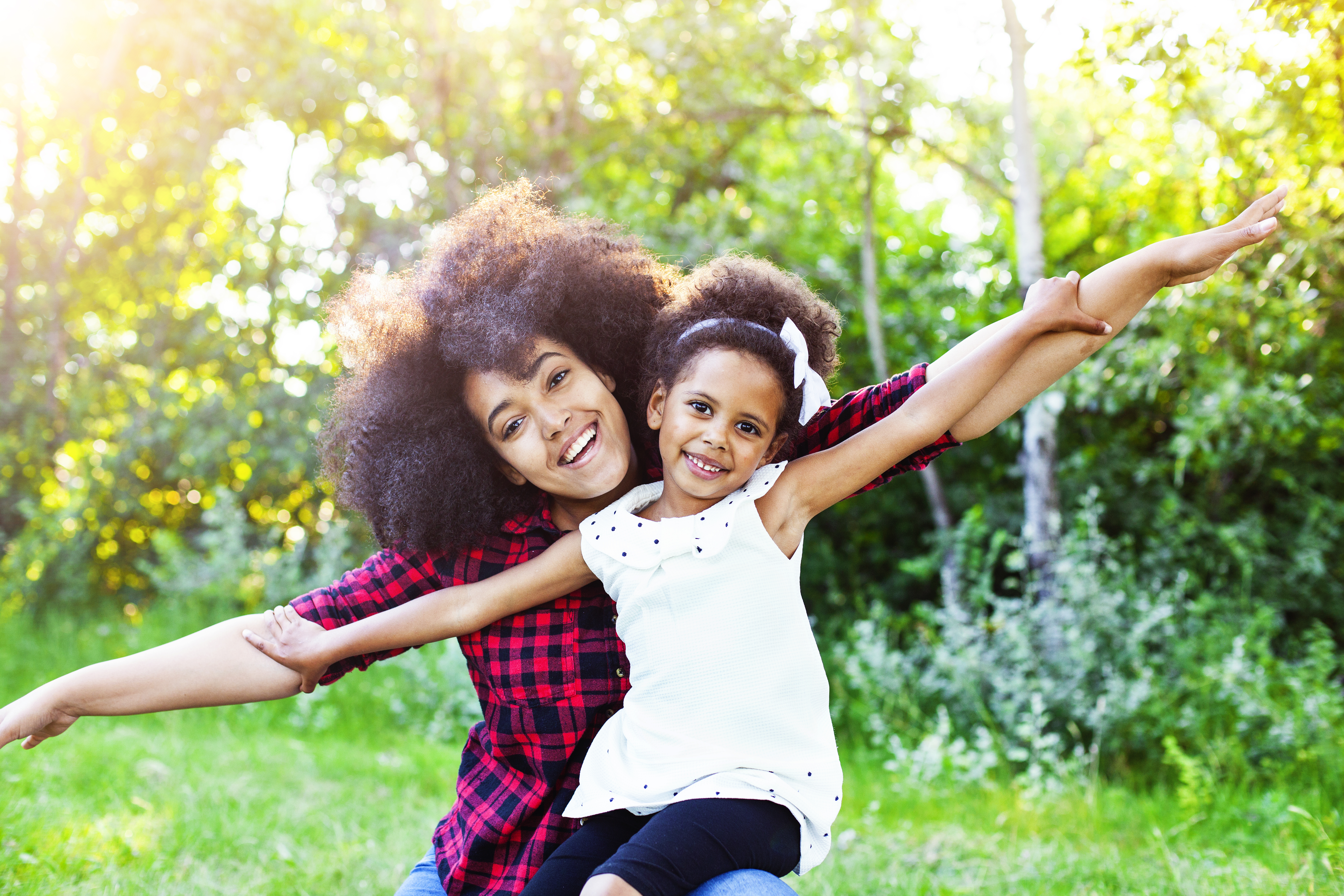 Mother and daughter flying