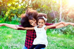 Mother and daughter flying