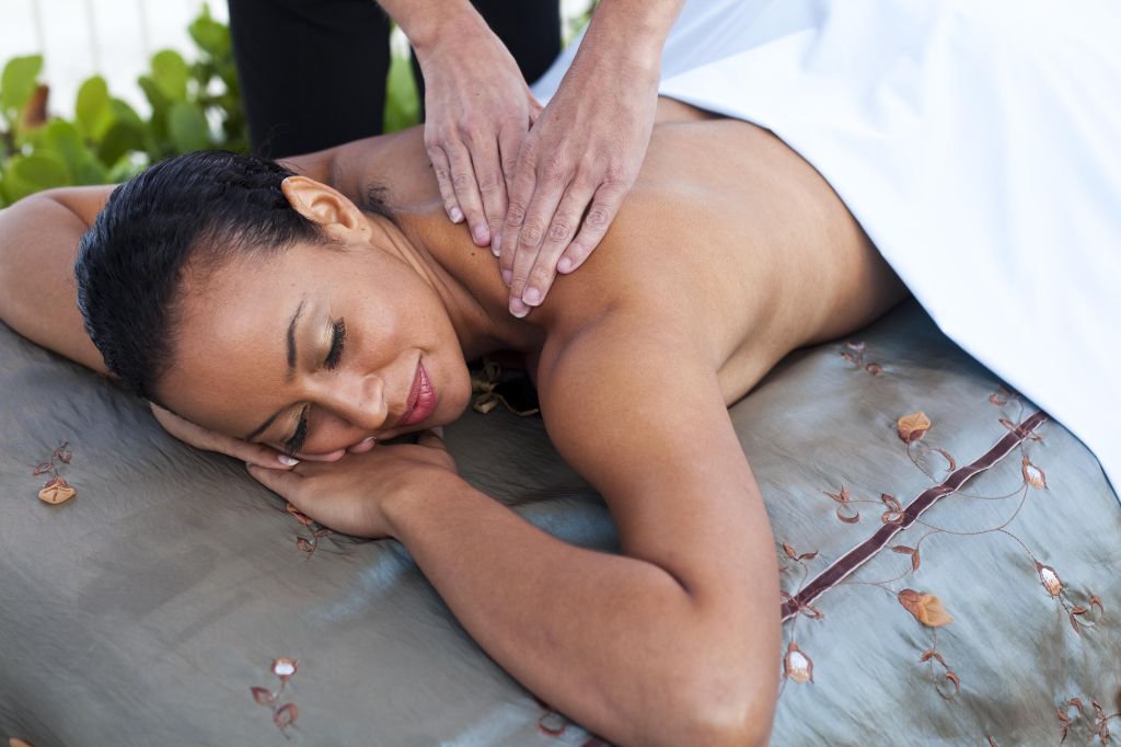 woman laying on massage table